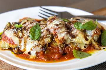 Cheese gratinated baked eggplant with Spanish Tomato Sauce