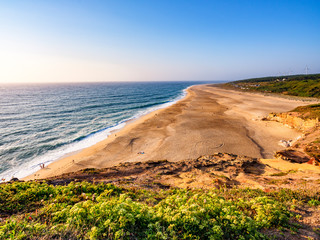 Praja do Northe, the wide bay of golden sands of Nazare, Portugal