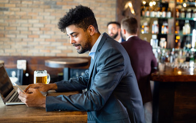 African american business man working with laptop in a restaurant