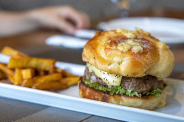 Ensalmada burger with fried sweet potato