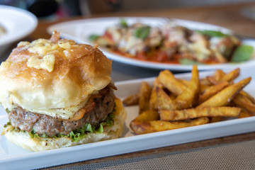 Ensalmada burger with fried sweet potato