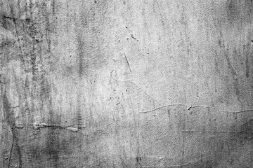 Texture of a concrete wall with cracks and scratches which can be used as a background