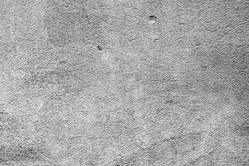 Texture of a concrete wall with cracks and scratches which can be used as a background