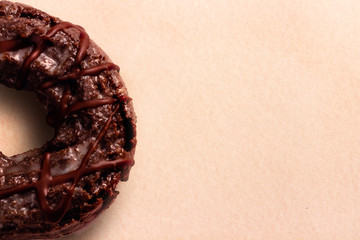 Chocolate donut muffin type on soft pink background. bakery concept