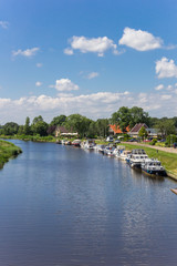 Fototapeta na wymiar Motorboats along the canal near Echten, Netherlands
