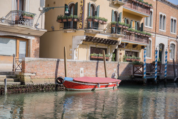 gondolas in venice near the pier