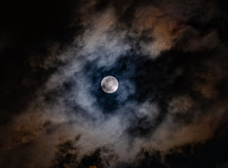 Obraz na płótnie Canvas Super Moon on a dark, cloudy sky on March, 9th 2020
