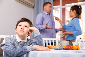 Unhappy boy with quarreling parents