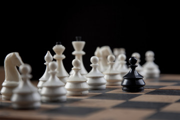 chess pieces on chessboard, checkmate photo dark bg