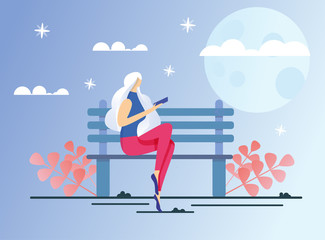 Young Woman with Long Loose Blond Hair, Totally Absorbed in Reading, Holding Electronic Book in Hands, Sitting on City Park Bench, Taking No Notice Night is Coming, Stars and Moon in Sky