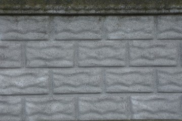 gray stone texture of concrete and bricks in the fence wall