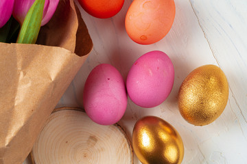 Pink tulips and  colorful eggs. Easter concept