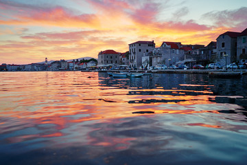 Beautiful sunset landscape. Old croatian town on the sea shore.