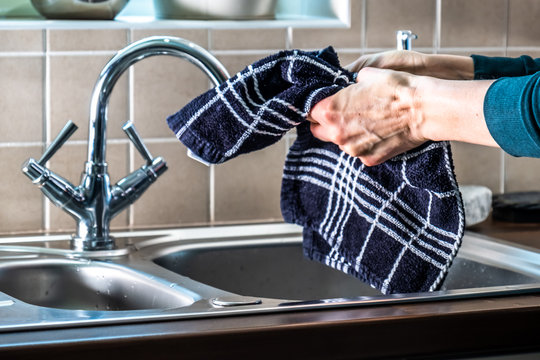 Proper Drying Of Hands Demonstrated At Steel Kitchen Sink