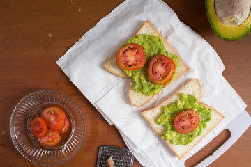 Avocado toast with fresh tomatoes slice and chinnamon
