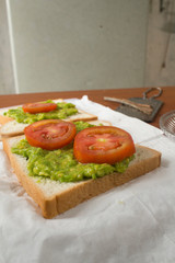 Avocado toast with fresh tomatoes slice