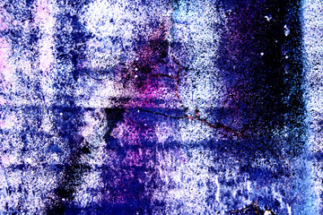 Surface texture with rest of blue and purple paint on concrete surface structure with cracks. For abstract backgrounds.