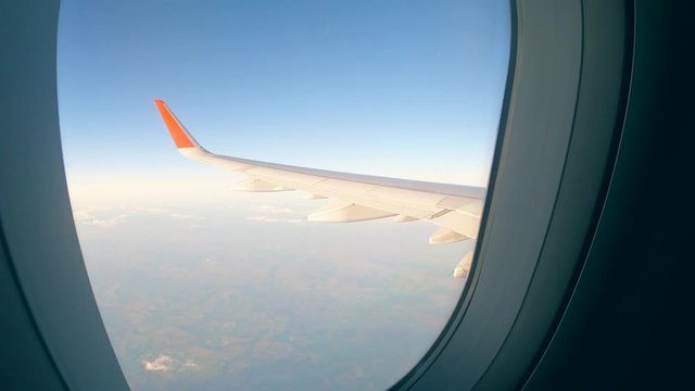 Aircraft wing is seen from the cabin of the vehicle