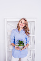 Portrait of a girl in the interior, florariums in the interior, interior solutions, business and home,plants in the interior, landscaping of the house and space