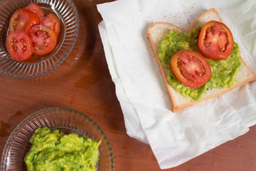 Avocado toast with fresh tomatoes slice