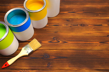 House renovation, paint cans on the old wooden background with copy space - Image