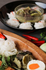 Thai Food Spicy Green Curry Chicken and Organic Vegetable, Chili and Herbs Come with Rice Noodles, Salted Egg. Homemade Asian Culinary.