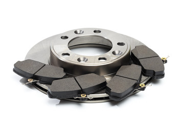 brake pads and brake disc isolated on white background .