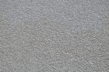 Gray horizontal wall covered with plaster texture.
