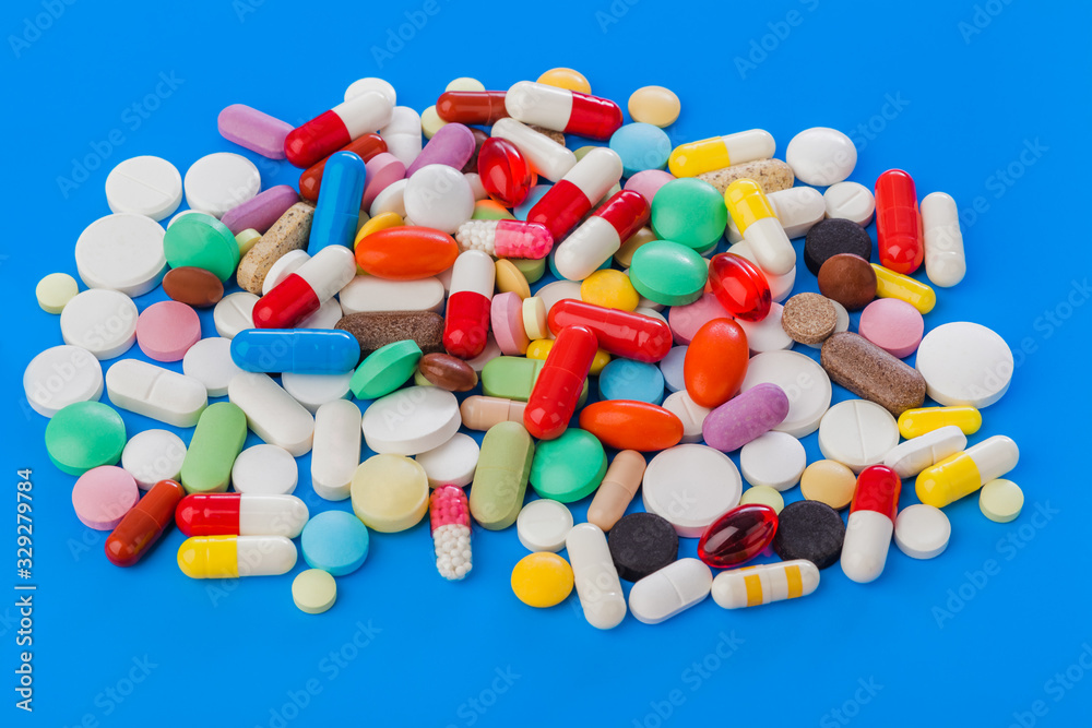 Poster heap of pills - medical background