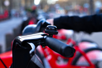 Handlebars of a red bike.