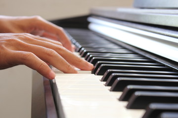 Fototapeta premium A man playing piano during the day.