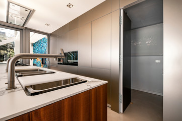 Luxury modern kitchen with marble worktop, modern kitchen sink.