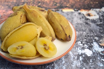 Naklejka na ściany i meble Pisang rebus or boiled banana. Pisang Kepok or Saba banana