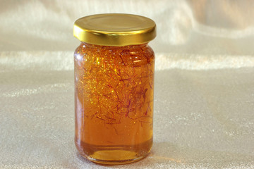 organic saffron honey in a jar