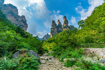 The entrance of Golden whip stream (Jinbian) with small river that leads the path. Trail from village through the park. Zhangjiajie National Park, Hunan, China