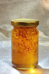 organic saffron honey in a jar