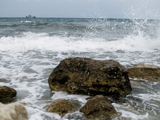 waves crashing on rocks
