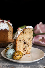 Easter composition with sweet bread, kulich and eggs on light background.