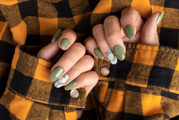 Beautiful womans hands with spring summer floral nail design