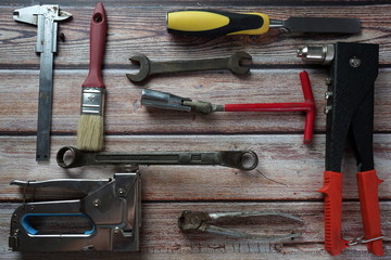Different tools on a wooden background