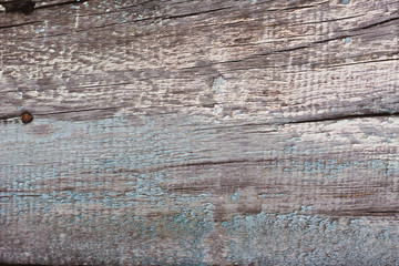 old peeling paint on a wooden background.