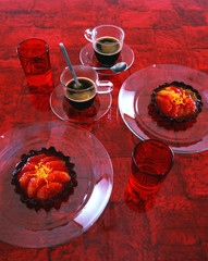 Red theme image of coffe and chocolate pastry dish
