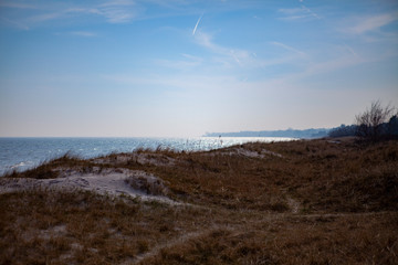 Costal view with graasy small hills down to the sea