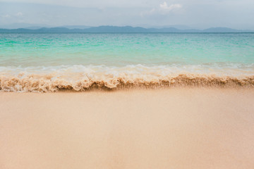 Fototapeta na wymiar Seascape view with beautiful ocean wave on sandy beach.