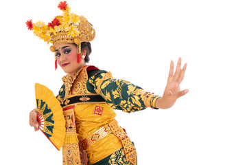 Balinese dancers hold a fan, traditional Indonesia dance culture costume