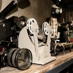 Background where old cameras and antique projectors are utilized in the interior