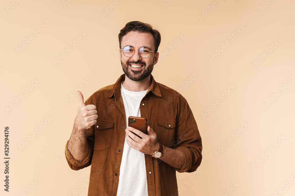 Poster portrait of a cheerful young arttractive bearded man