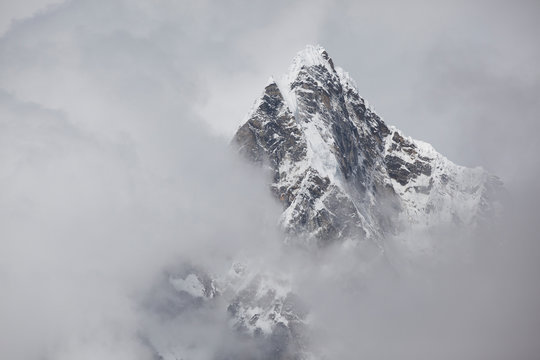 Tobuche Peak, in Stormy Clouds, Nepal. Trek to Everest Base Camp.