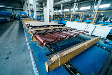 Fototapeta na wymiar Metal tile manufacturing factory. Steel sheet metal