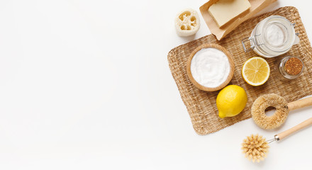 Fototapeta na wymiar Bio natural cleaners - lemon, baking soda, salt on white